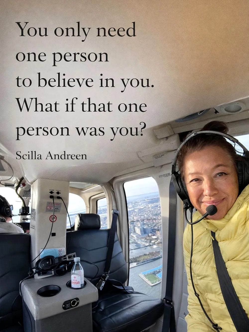 Scilla in a headset and yellow jacket, smiling in a helicopter above a city, beside her words: You only need one person to believe in you. What if that one person was you?